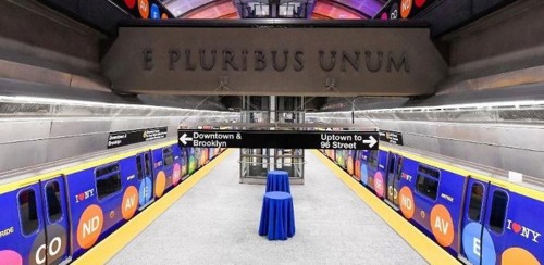 A stock image showing the 72nd street station with Latin wording on a concrete cross beam