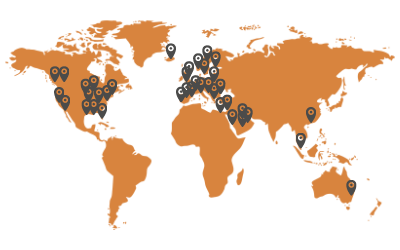 An orange world map with locations of Woods Distributors marked on it