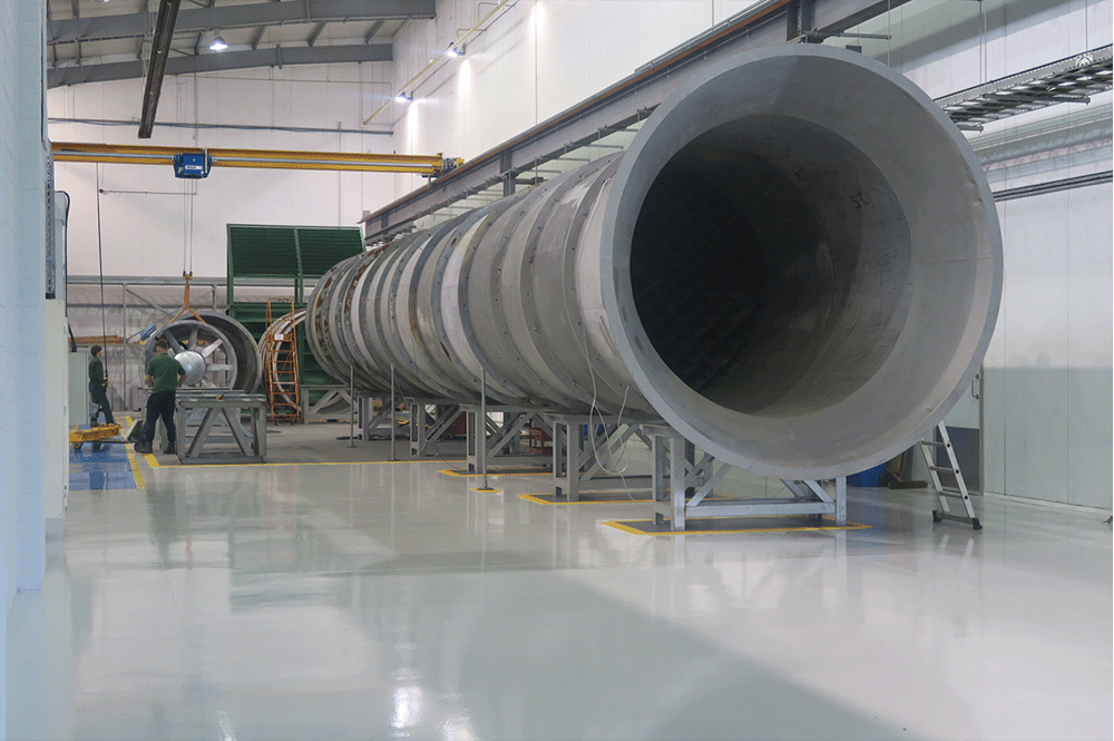 A photo of the Woods laboratory where a large Axial Fan is being tested