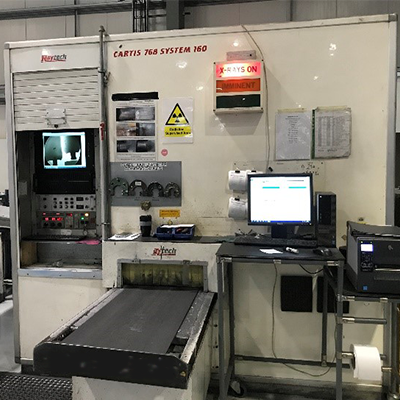 A photo of the x ray machine at Woods used for small fan components