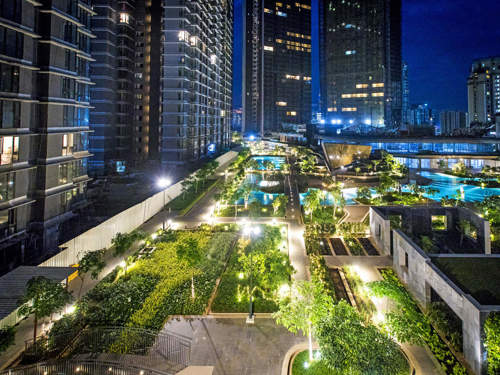 A night time shot of an sophisticated high rise residential block