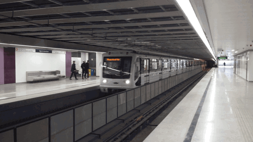 A stock image of a clean metro station with a train just arriving
