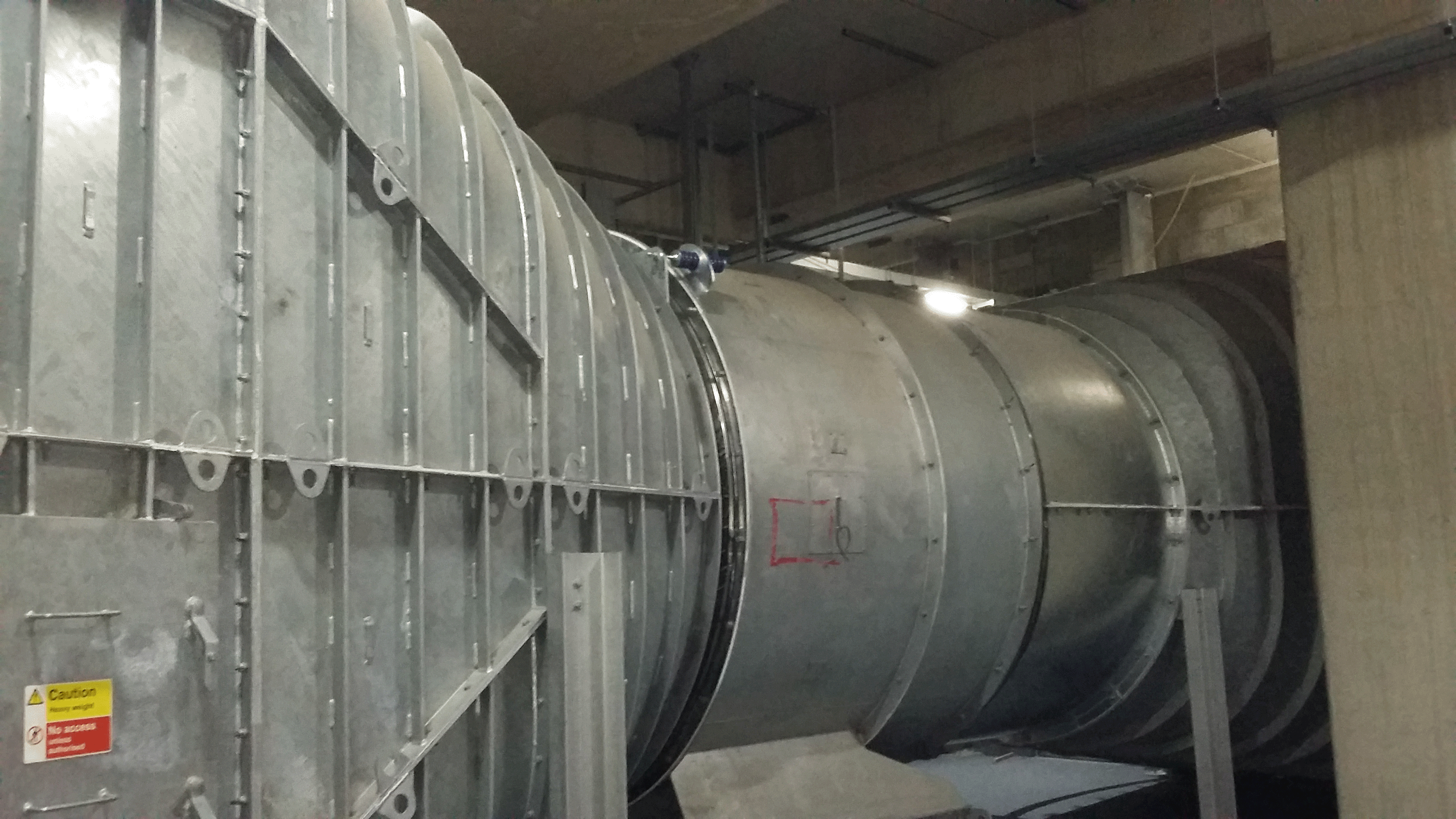 A photo showing the casing of an axial fan installed